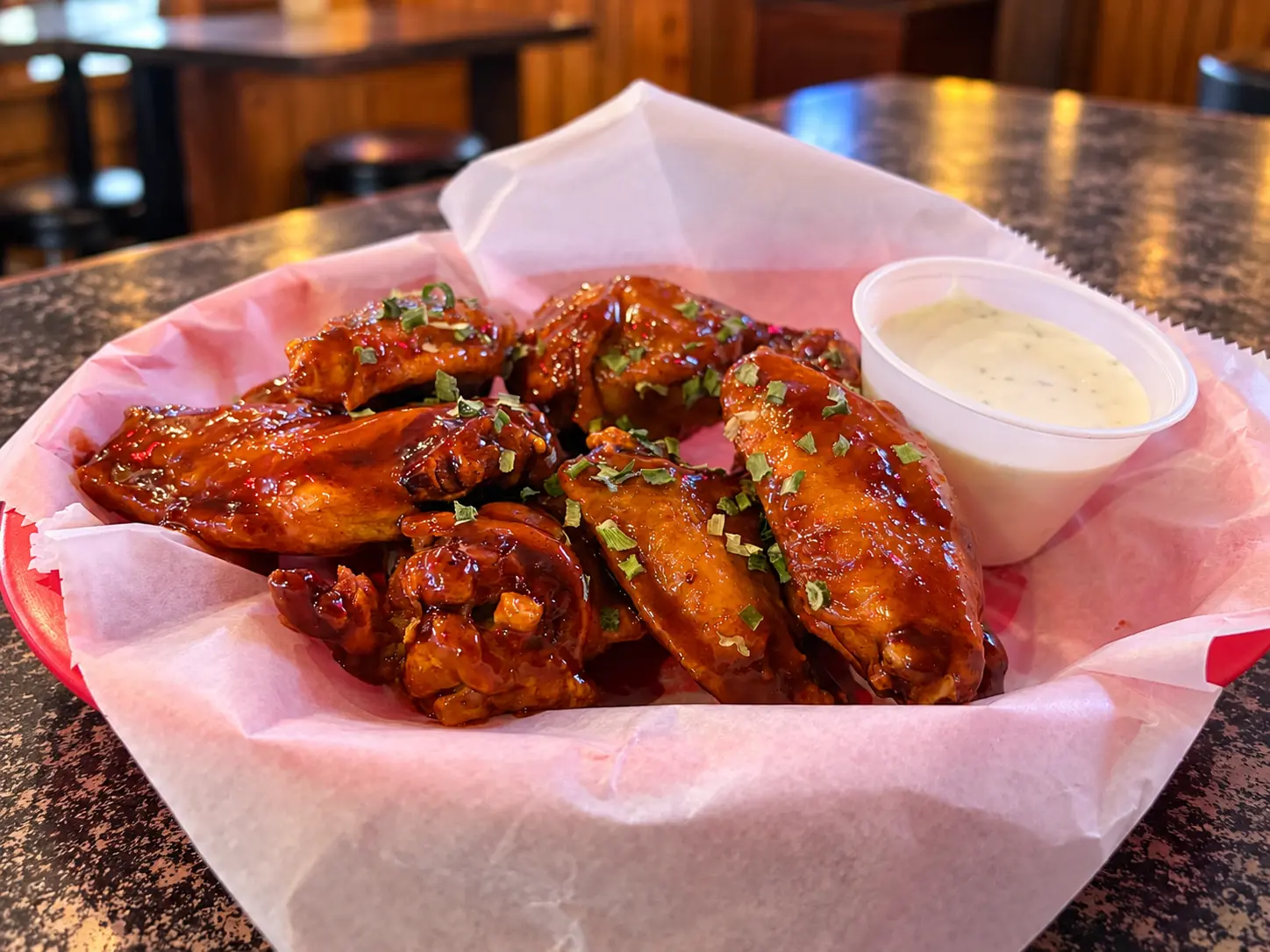 Glossy barbecue chicken wings at Winifred Tavern